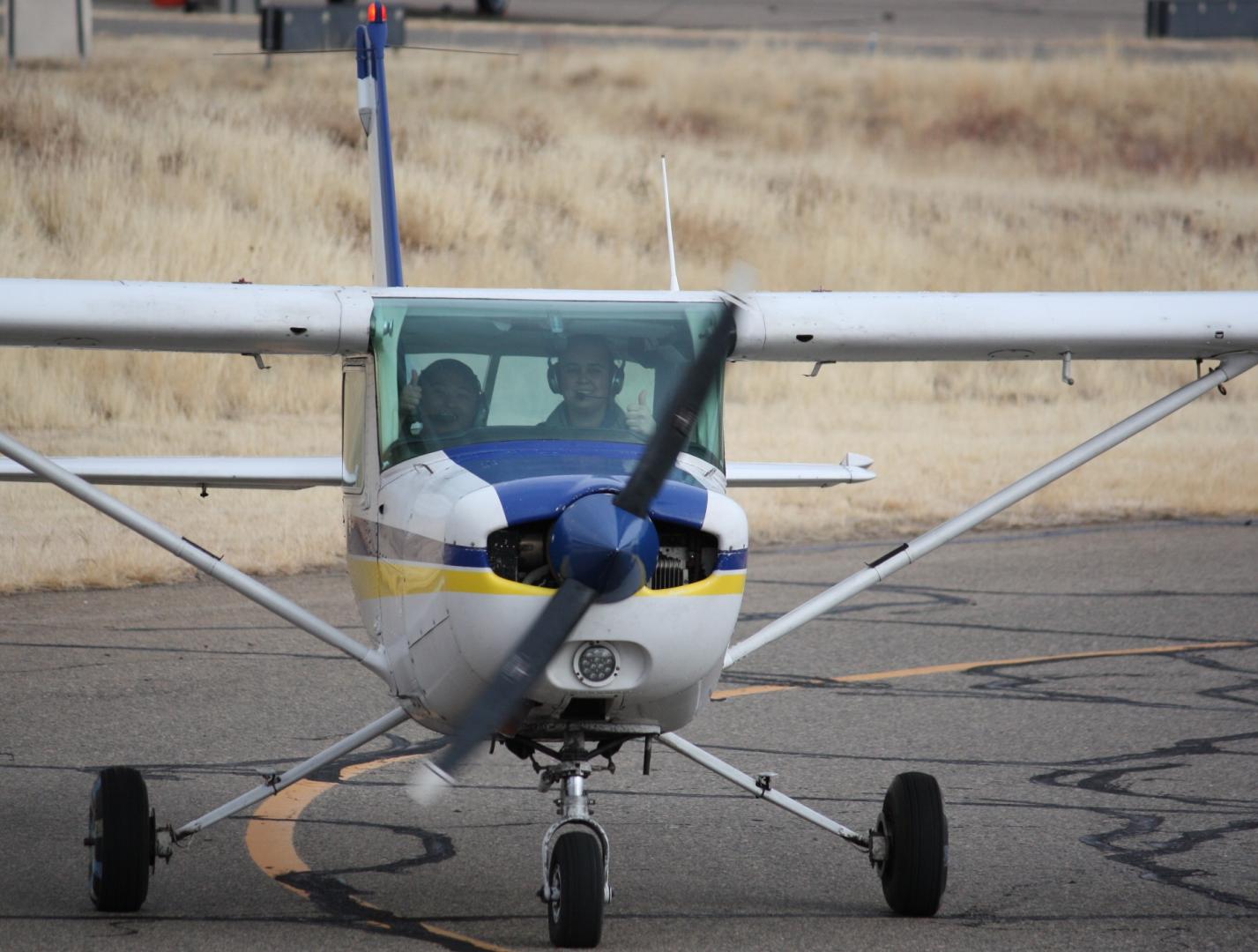 Pilot Chloe and sophomore Carlo land plane after placing 4th places