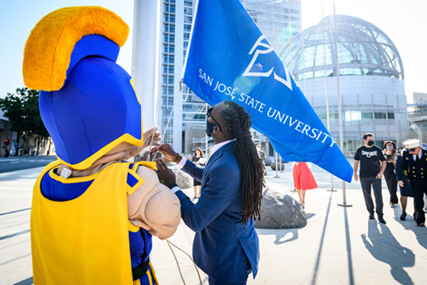 Sammy Spartan at San Jose City Hall raising the SJSU flag..