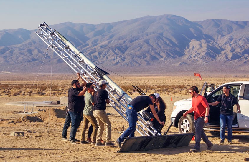 students outside with aerospace machine