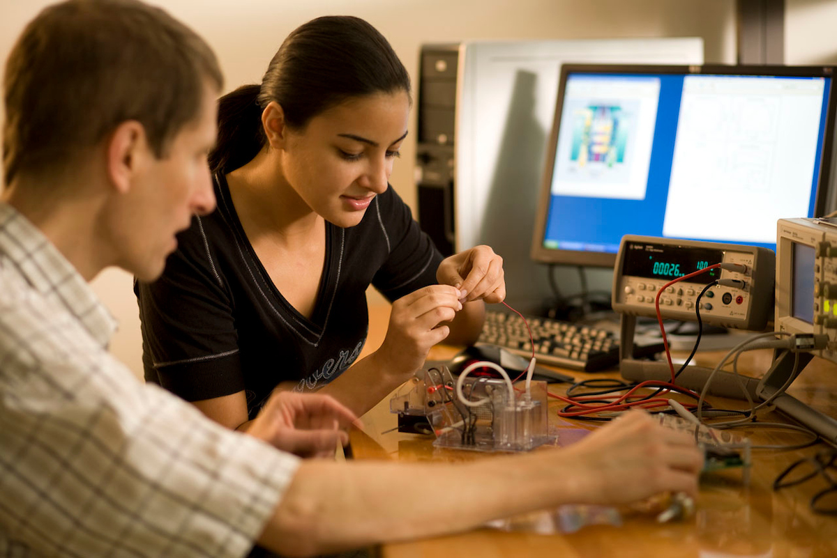 students in a lab with materials