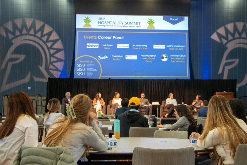 Students listen to panel at the Hospitality Summit