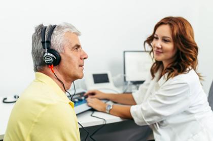 Audiology student conducts a hearing screening