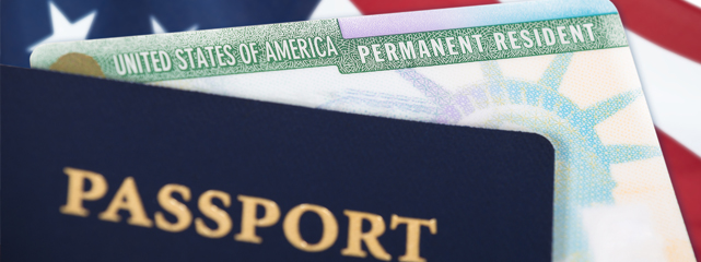 A passport in the foregroud with the American flag in the background.