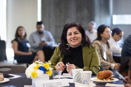 Dr. Nancy Gutierrez seated at a table during the Celebration of Education event