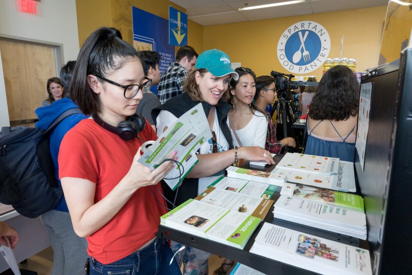 Students receiving resources on campus