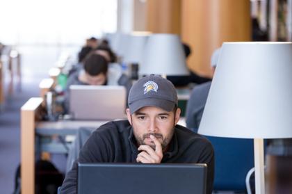 Student looking at computer intently