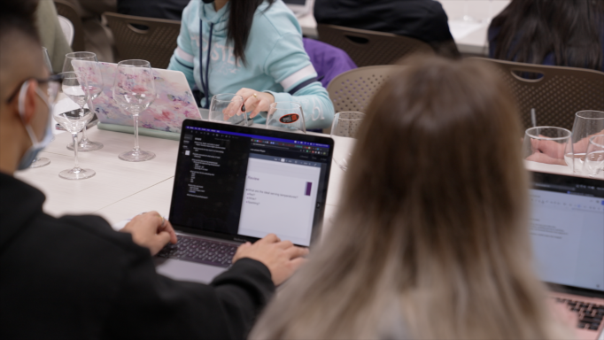 Students taking notes on laptops