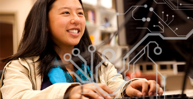 female student working on computer with data graphic overlay