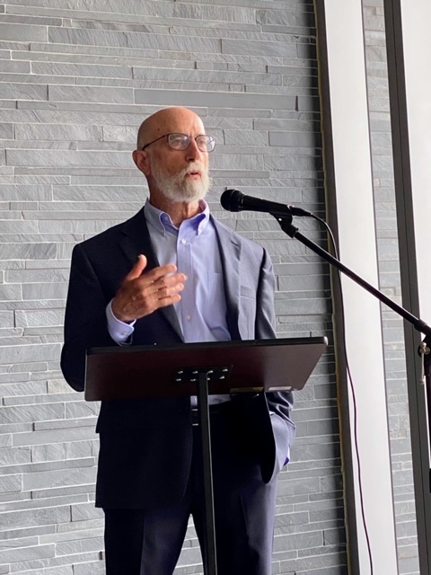 Dr. David Furst standing, giving a lecture