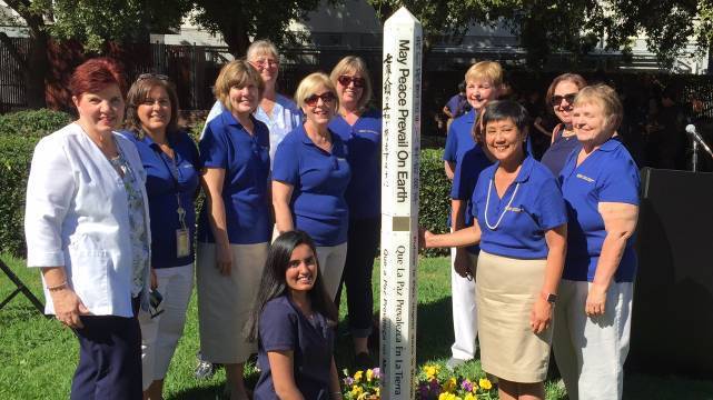 Some SON faculty members around the Peace Pole statue on SJSU campus