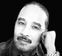 black and white headshot photo of Luis Arabit