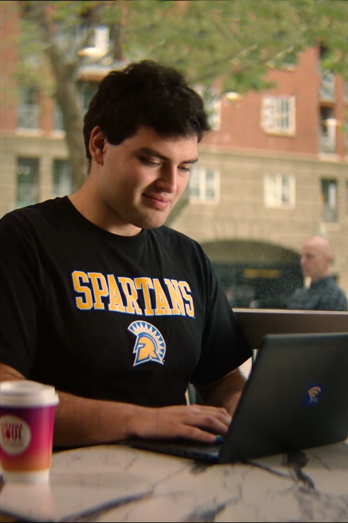 SJSU student using a laptop