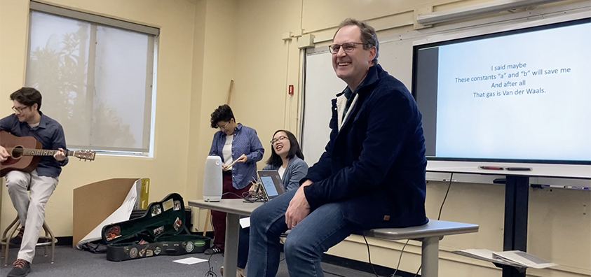 Photograph of faculty members singing a parody of "Wonderwall"