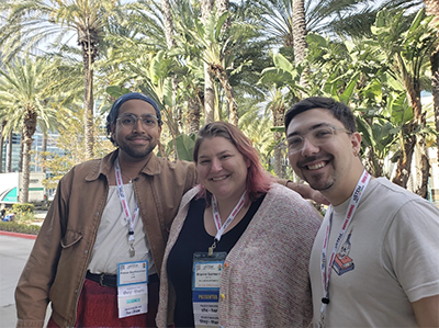 Photograph of Jacob Garner, Pranav Seetharaman, and Prof. Brianne Gutmann at the oSTEM conference.