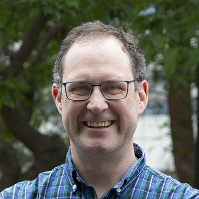 Headshot of Christopher Smallwood.