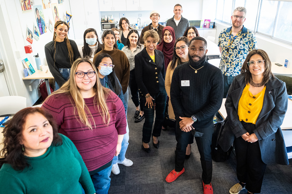 The president posing with College of Education students.