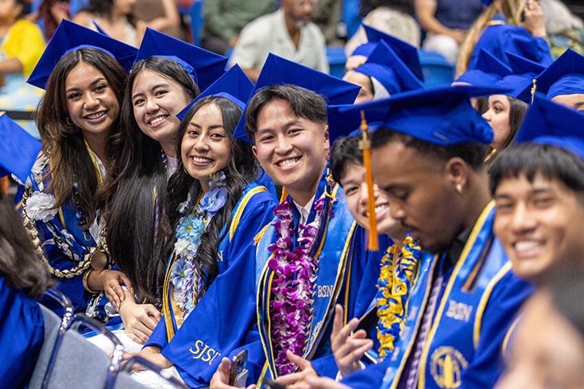 Happy students celebrating at a commencement ceremony