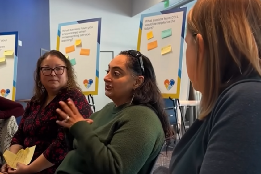 Professors discussing at an event.