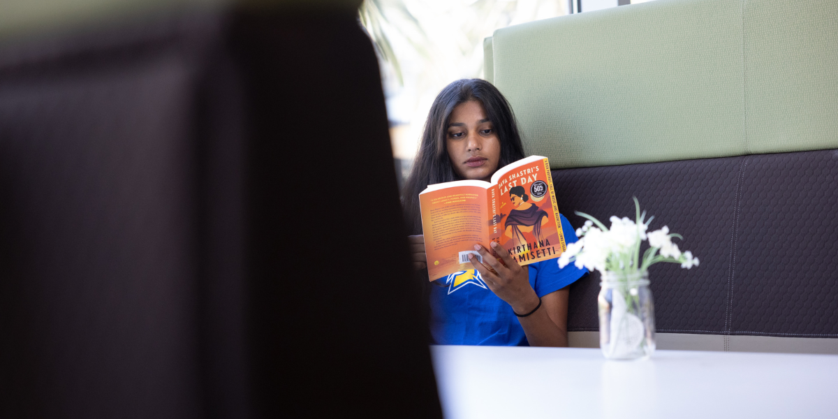 student reading a book